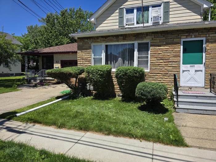 Trimmed bushes and tidy lawn at a family home